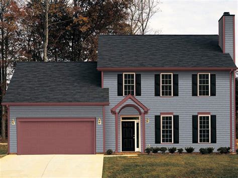 gray house metal roof|grey house with black awnings.